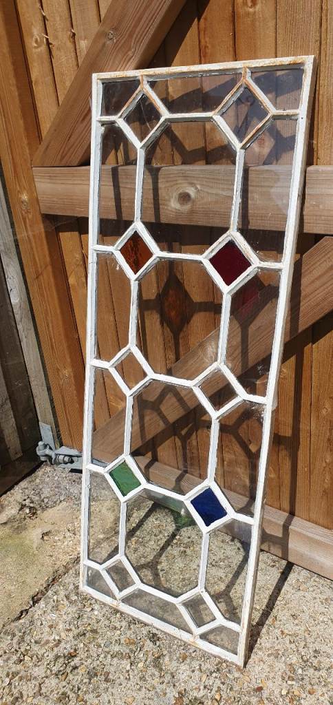 White Metal Window Frame with Coloured Glass Panels