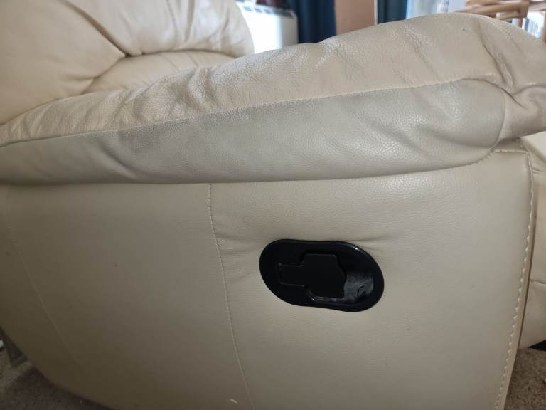 Leather reclining armchair with footrest