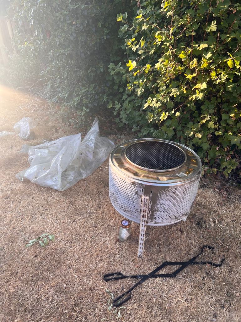 Fire Pit Washing machine drum on legs with Fire tongs