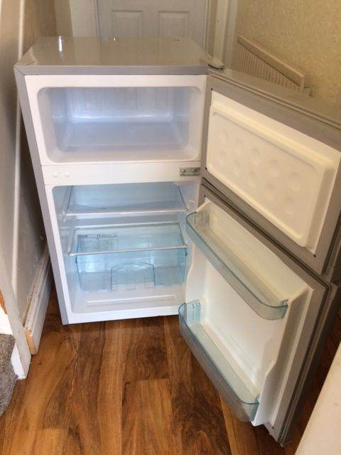 SLIMLINE SILVER LOGIK UNDER-COUNTER FRIDGE WITH FREEZER COMPARTMENT IN EXCELLENT WORKING CONDITION