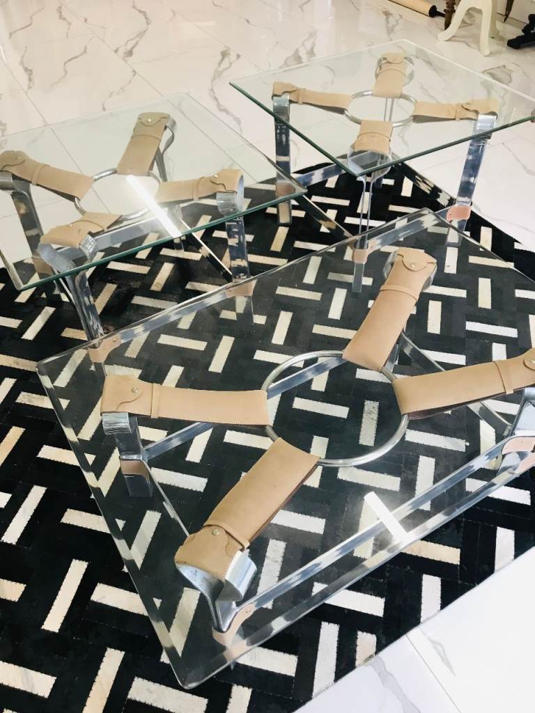 Three glass topped equestrian tables by James Brindley of Harrogate