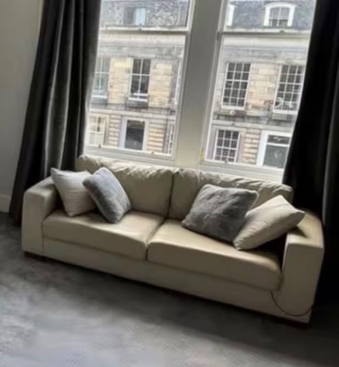 Cream Leather Two-Seater Sofa – Good Condition