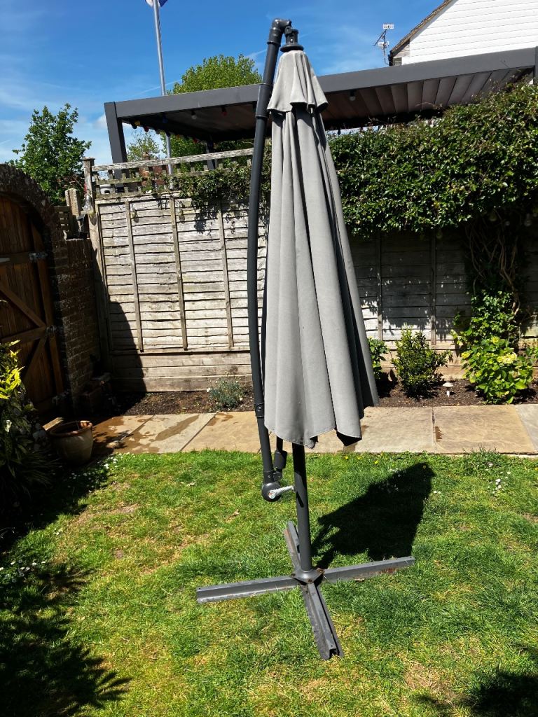 Large 295cm garden cantilever parasol in grey including cover and base weights