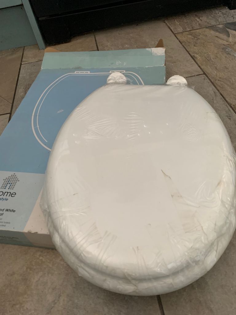 Home of Style Moulded Wood White Toilet Seat wrapped in box