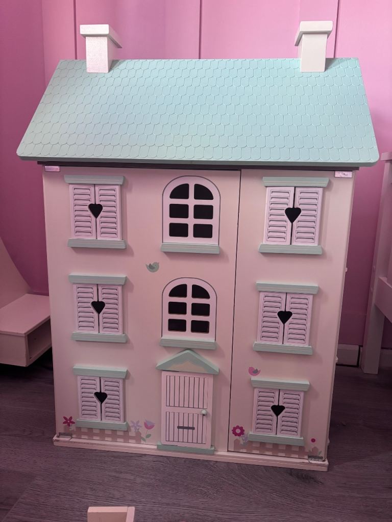 Blue and white doll house with furniture