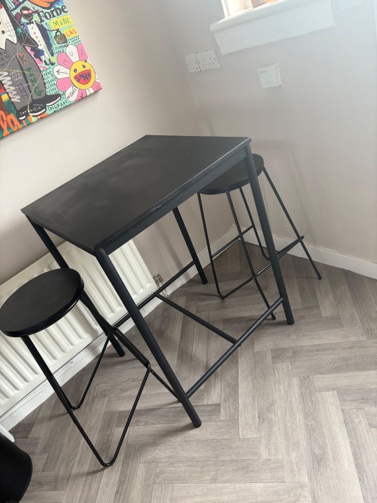Black breakfast bar/table and two stools