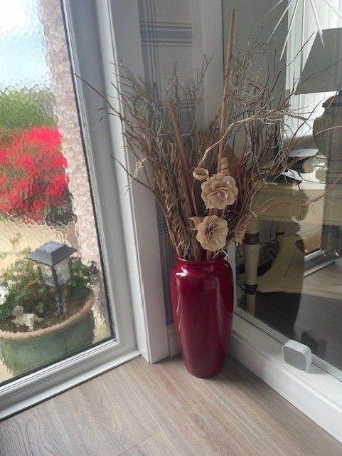 LARGE RED FLOOR VASE INCLUDING ALL TWIGS/TREES FLOWERS AND LIGHTS ETC.