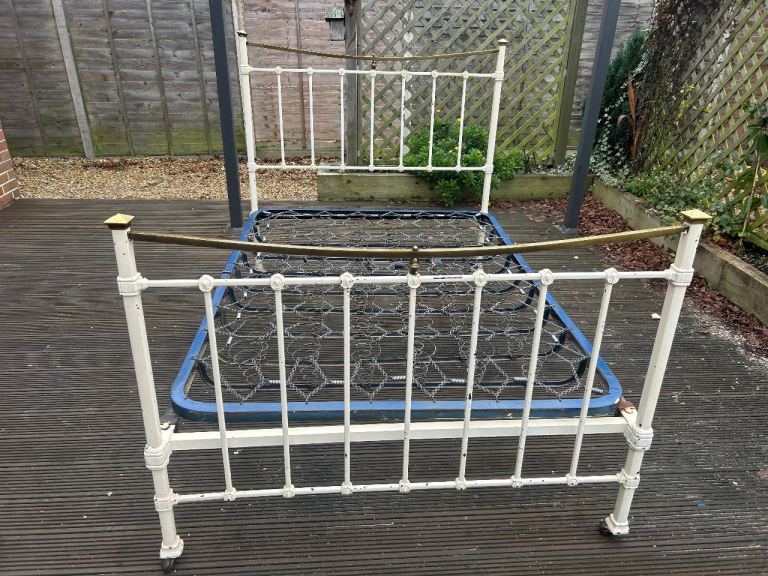 Antique cast iron and brass bed. Possible delivery 