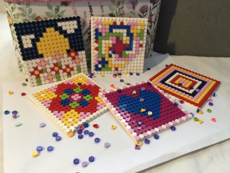 Five Lego templates one Lego bracelet and two Lego picture frames with Lego dots to decorate 