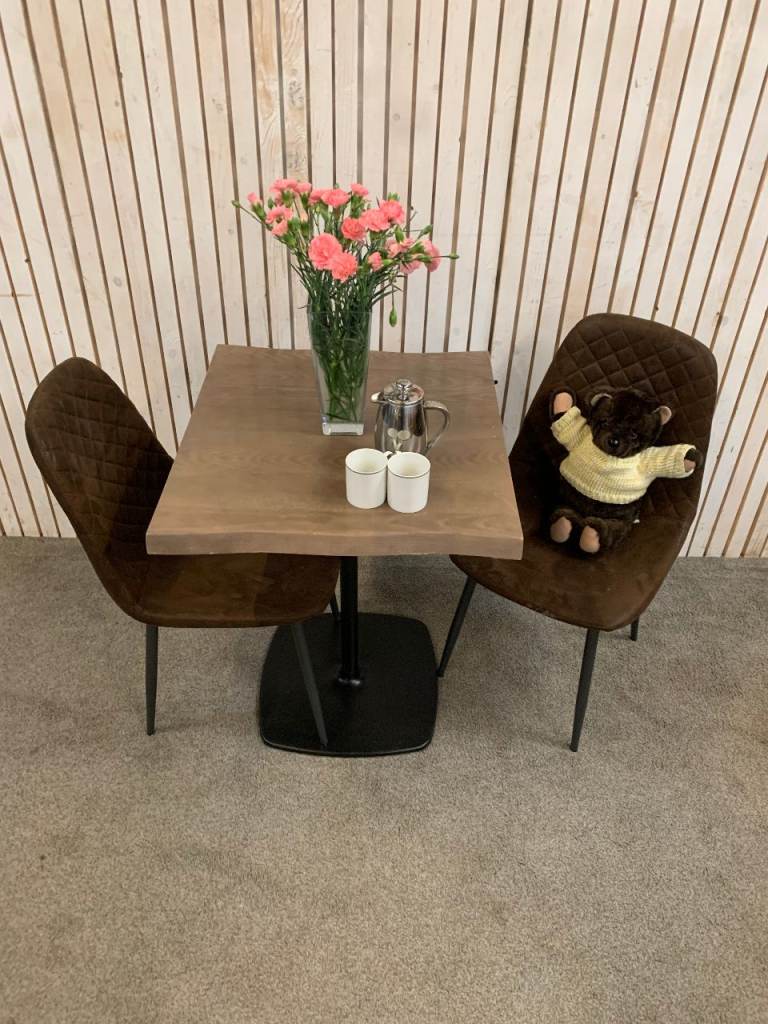 Bistro Dining Table with two Chairs, featuring Square Bown Faux-Suede Seats .