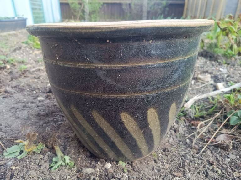 Dark green glazed plant pot
