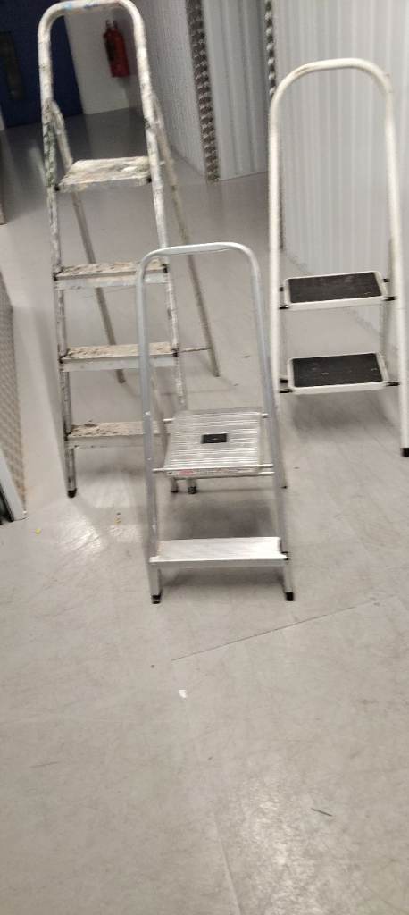 Three sets of step ladders 