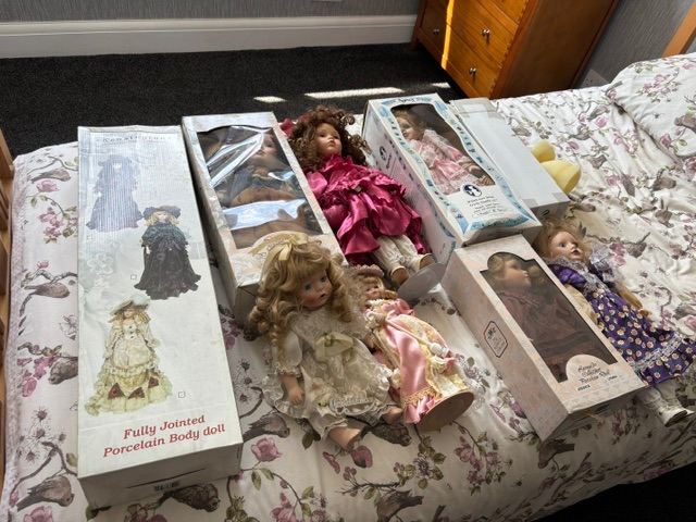 Collection of China / porcelain dolls x 8