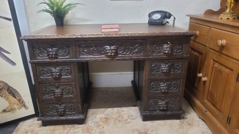 Stunning Victorian carved oak double pedestal desk featuring distinctive Green Man motifs 