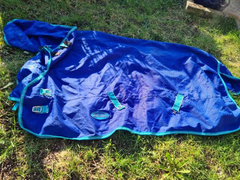 5ft 9inches Blue wheatherbeeta horse rug