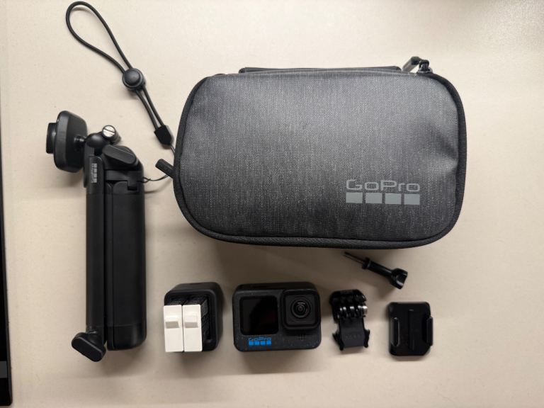 GoPro HERO12 Black bundle — 3 batteries, dual charger, 3-Way grip, carry case