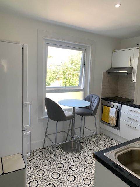 Glass Poseur/High Top Table and 2 Grey Velvet Bar Stools. 