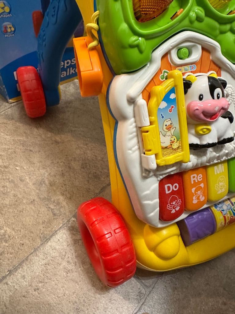 VTech Baby First Steps Walker, a 2-in-1 activity center and push-along walker