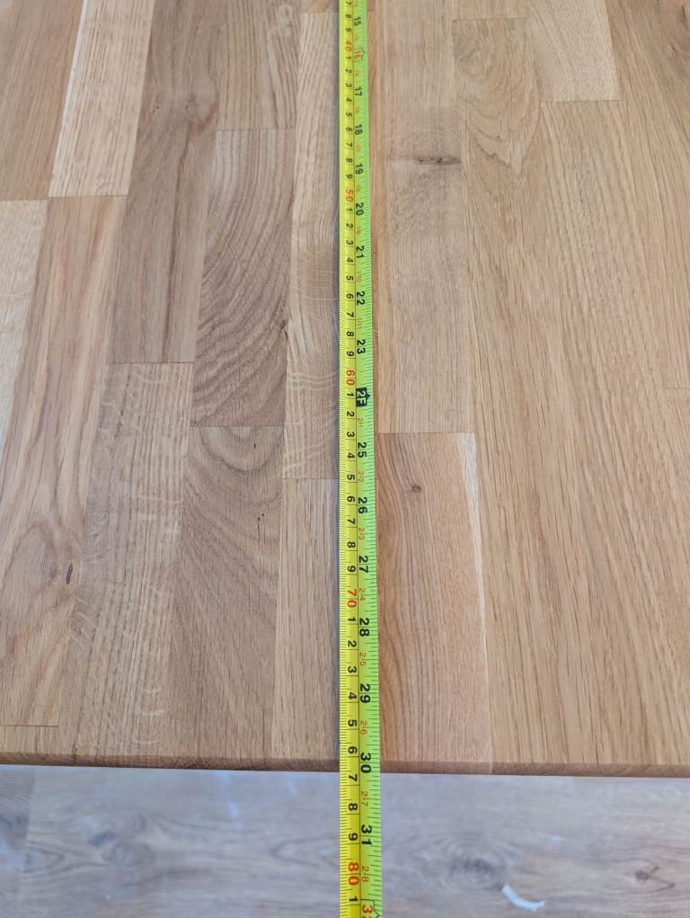 Solid Oak dinner table with cast iron base