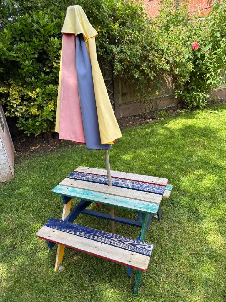 Kids picnic table and parasol. Free to a good home 