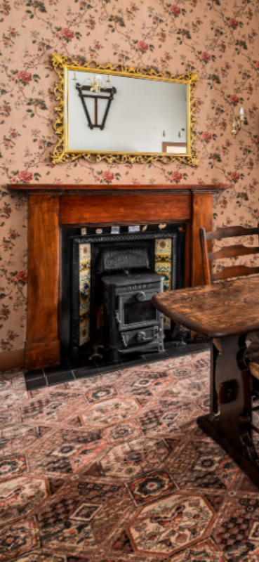 Wooden fire surround with antique cast iron insert 