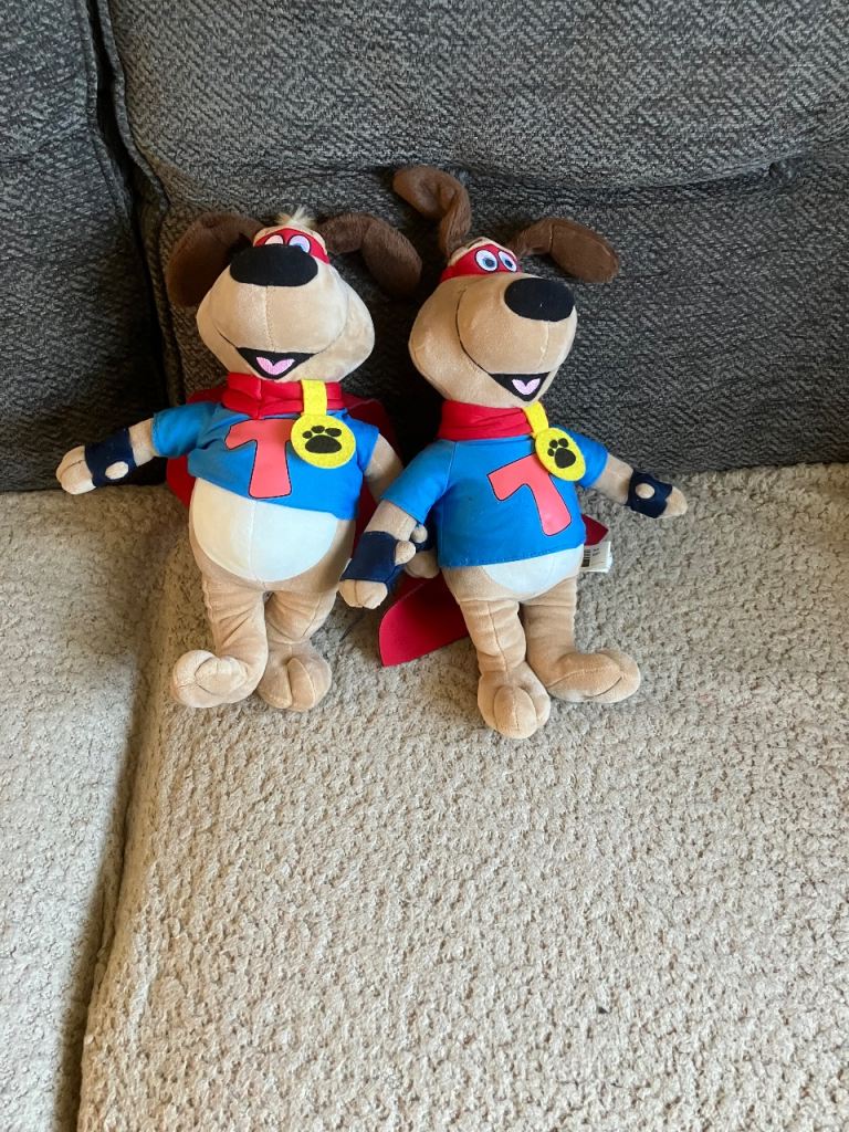 Two Tui soft toy dogs