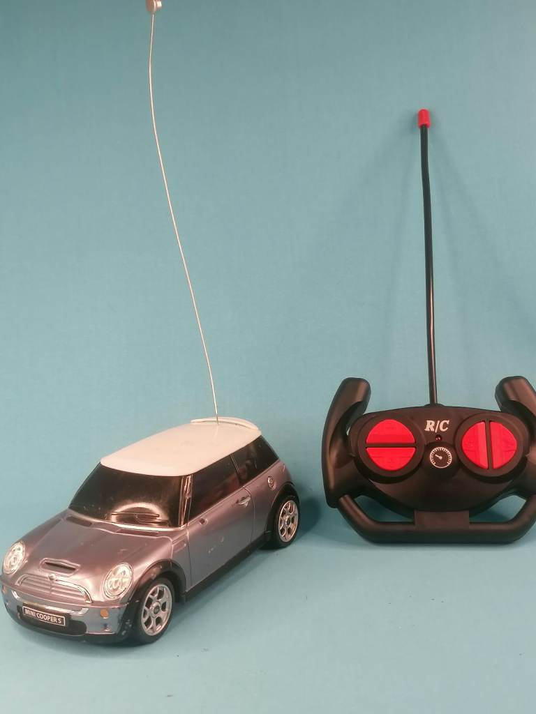 Mini Cooper Car with remote control. is in ok shape with some scratches and missing  mirror. 