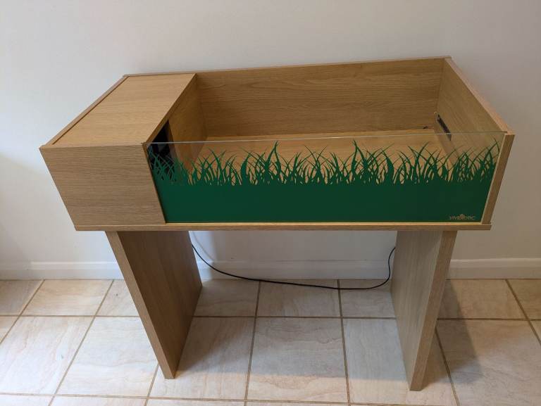 Tortoise table with stand and heat pad