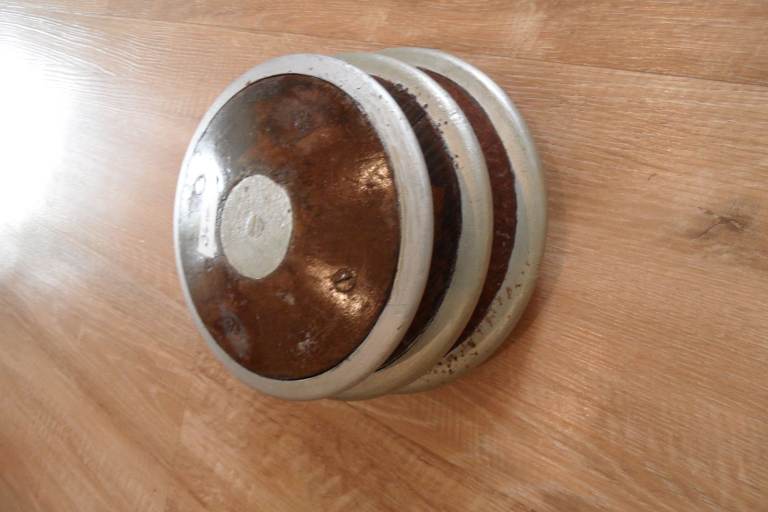 Three old discus. (Athletics)