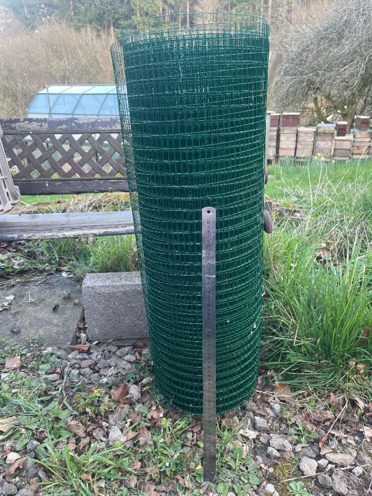 Remains of a roll of fence wire used to make a chicken run