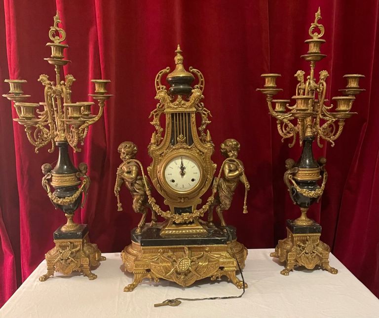  Clock and matching candelabras 