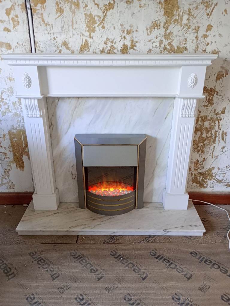 Electric fire including marble hearth, backplate and wooden fireplace