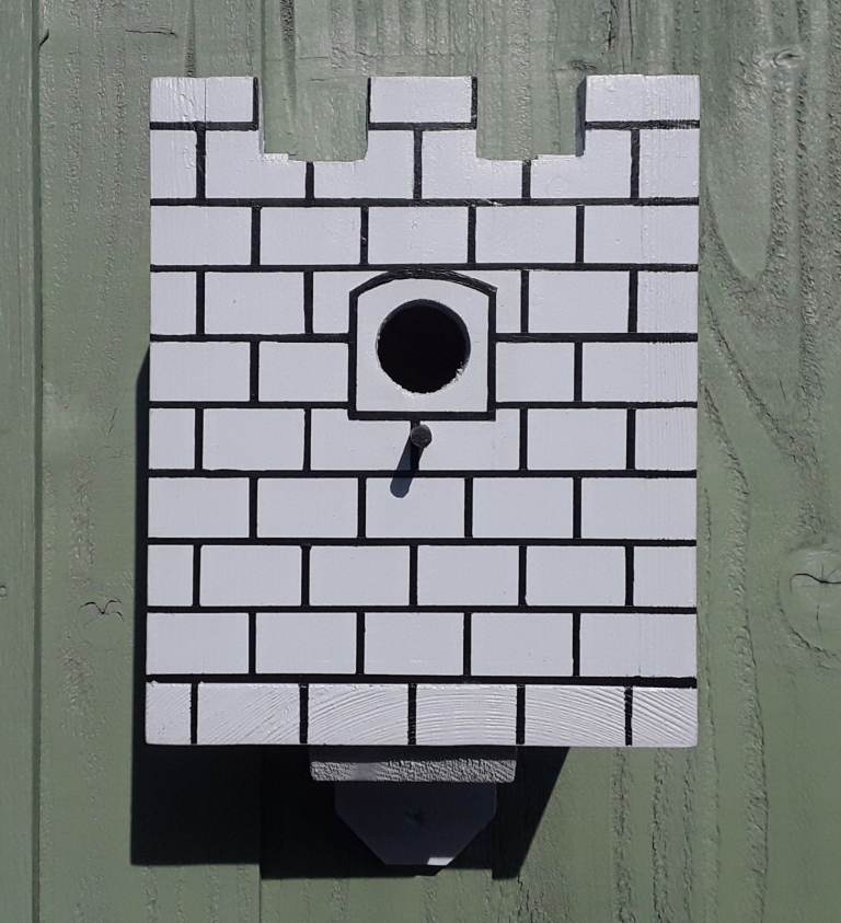 Bespoke heavy duty castle design bird box and wall mounted stand.