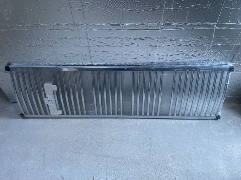 Chrome, curved heated towel rail