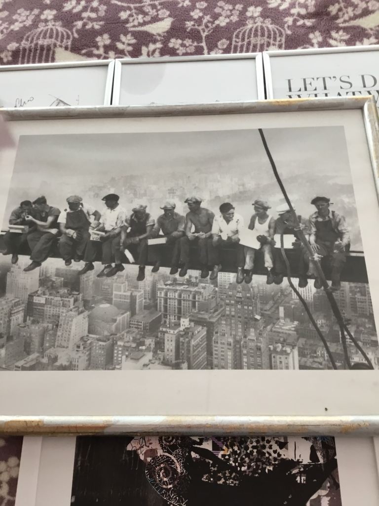 Picture framed of New York men sitting on a girder.