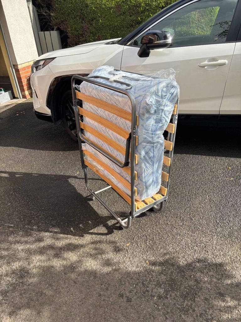 image for New foldable single bed on wheels with matress