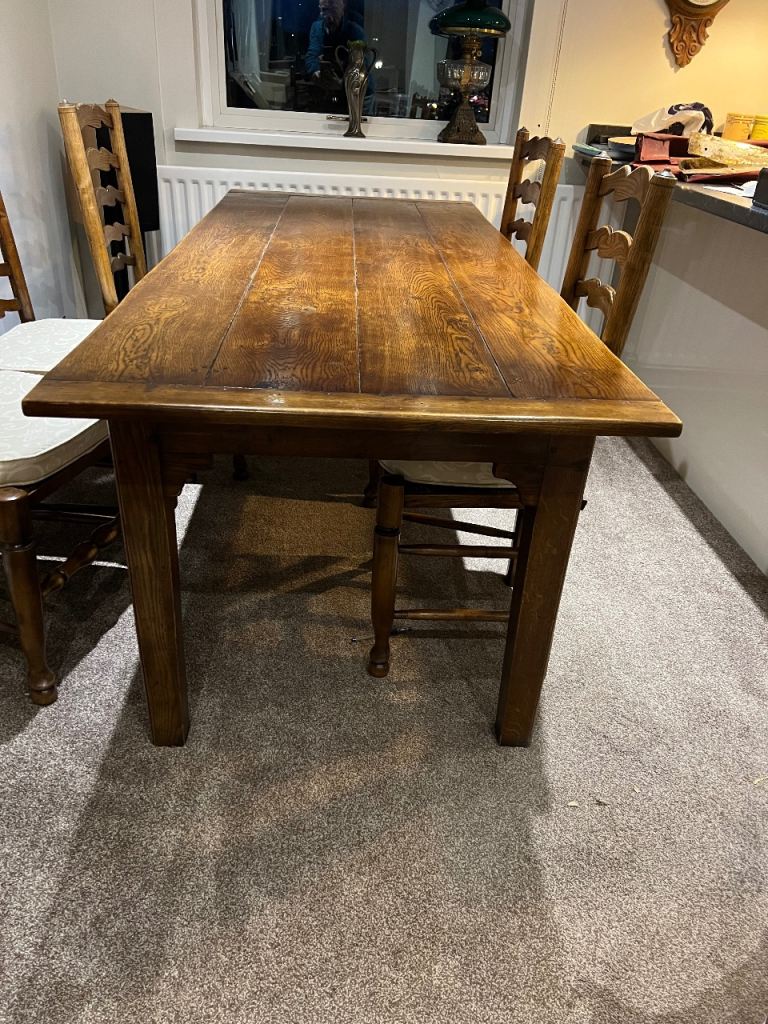 Large oak table with eight chairs