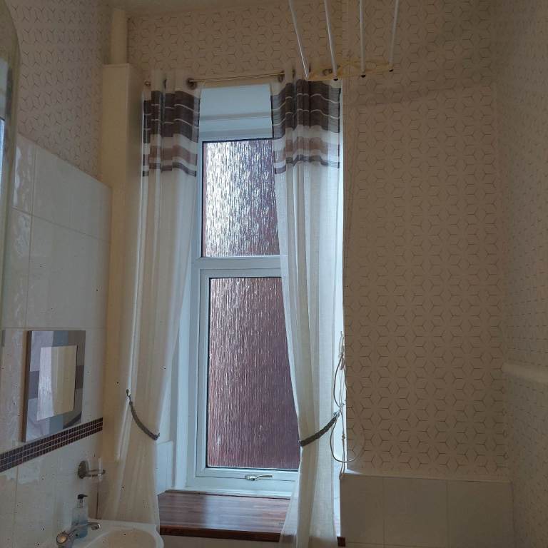 Cream patterned voile eyelet curtains - excellent condition