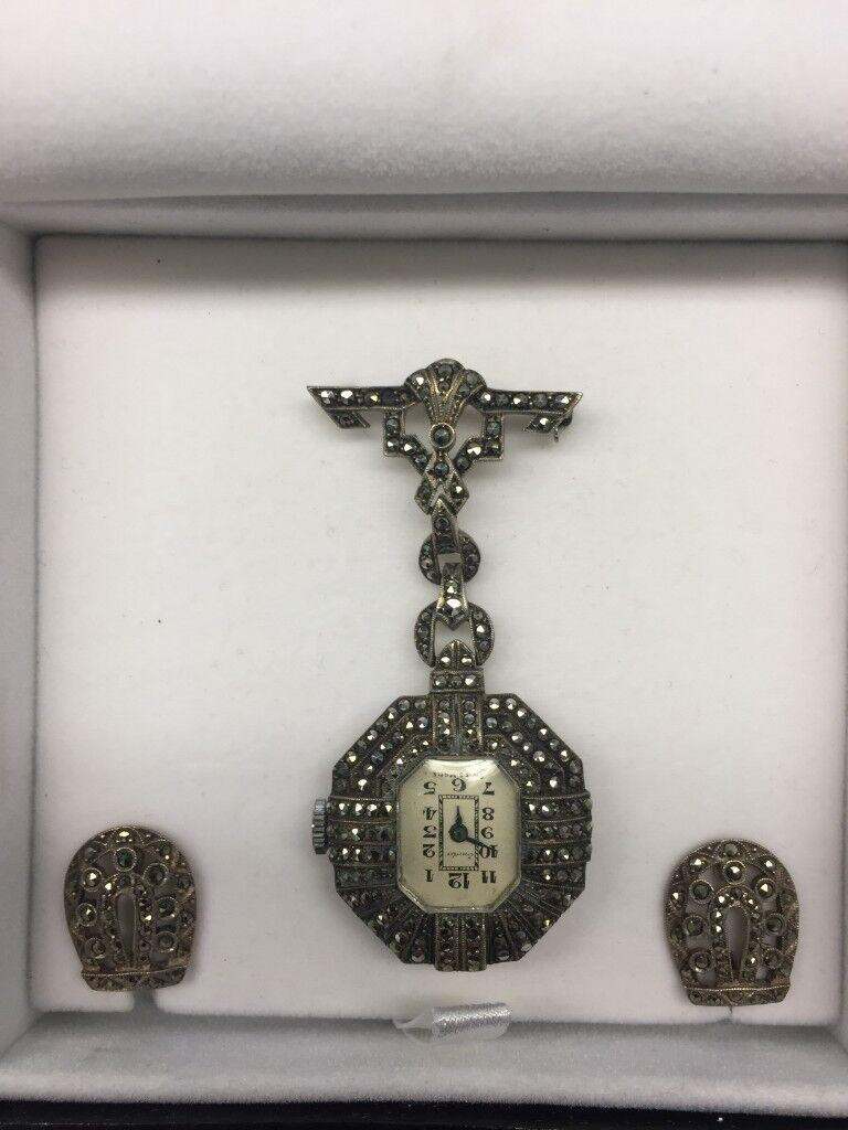 Silver and marcasite nurses fob watch and matching clip on earrings