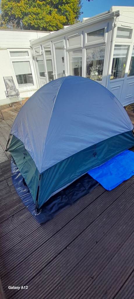 A BRAND NEW UNP 2 PERSON TENT 