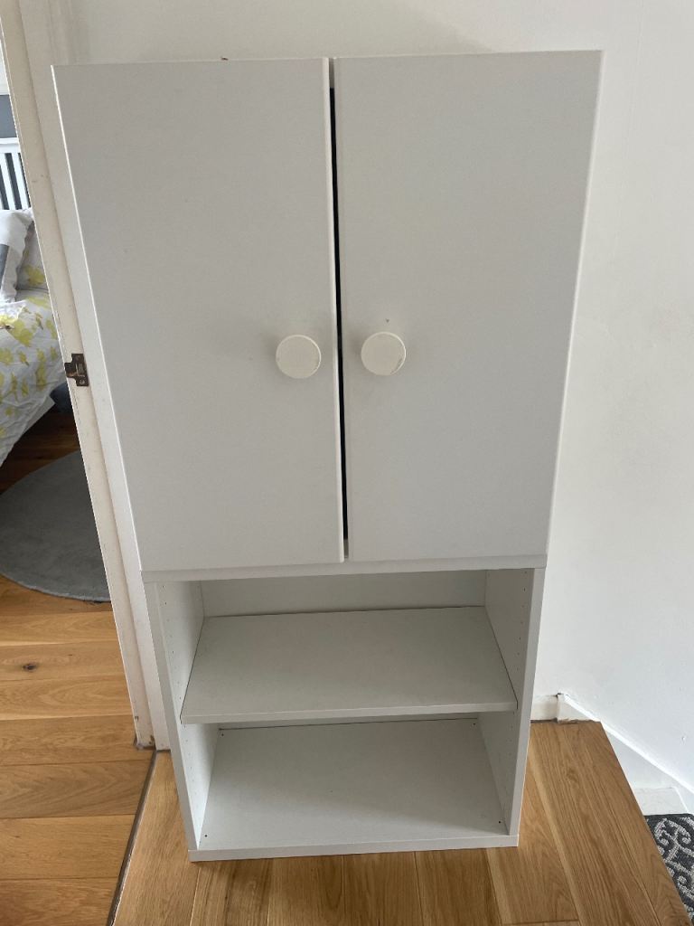 White Ikea shelf and cupboard combo