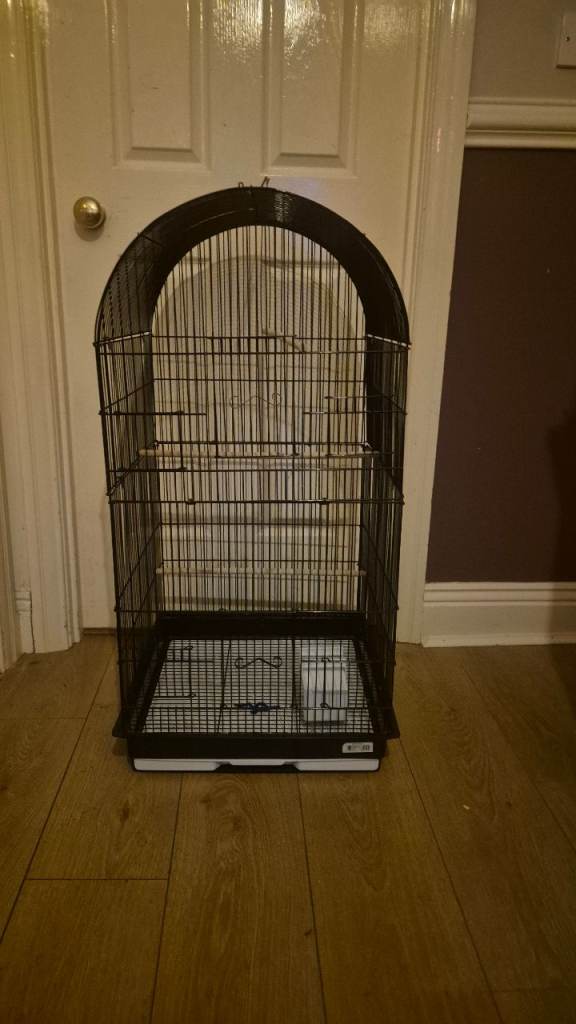 Bird cage with perchs and feed trays