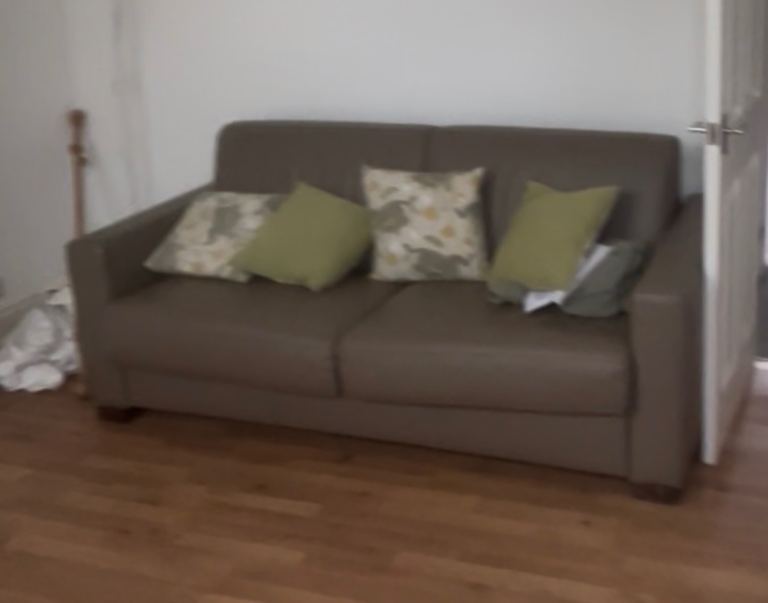 Three seater faux leather fold out sofa bed