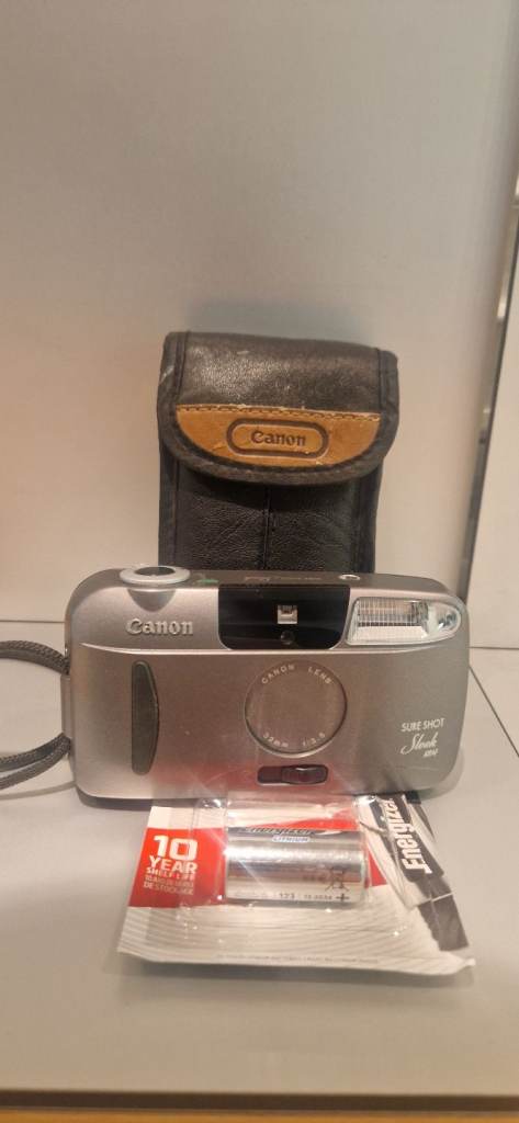 Canon Sure Shot Sleek 35mm Film Point  Silver Camera with leather pouch