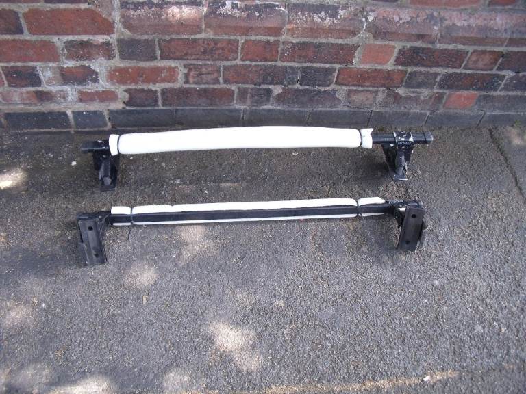 A pair of THULE Roof Bars for Small 4 Door Cars