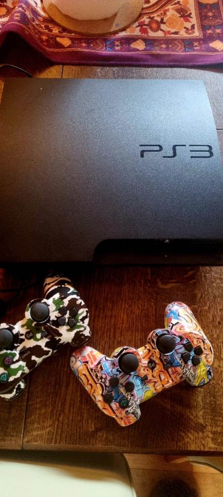 Ps3 with 2 controllers and loads of games