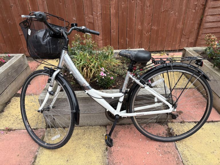 White Apollo Hybrid Bike with Front Basket and Rear Rack