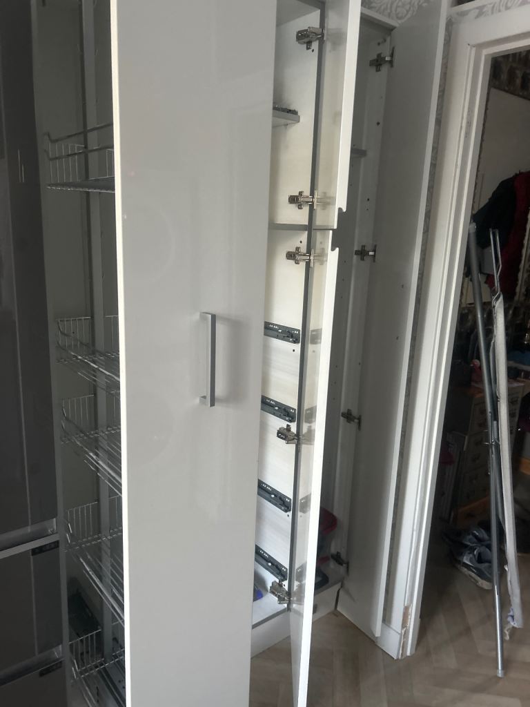 White laminate kitchen units 9 with double sink and circa 6.5m worktop. 