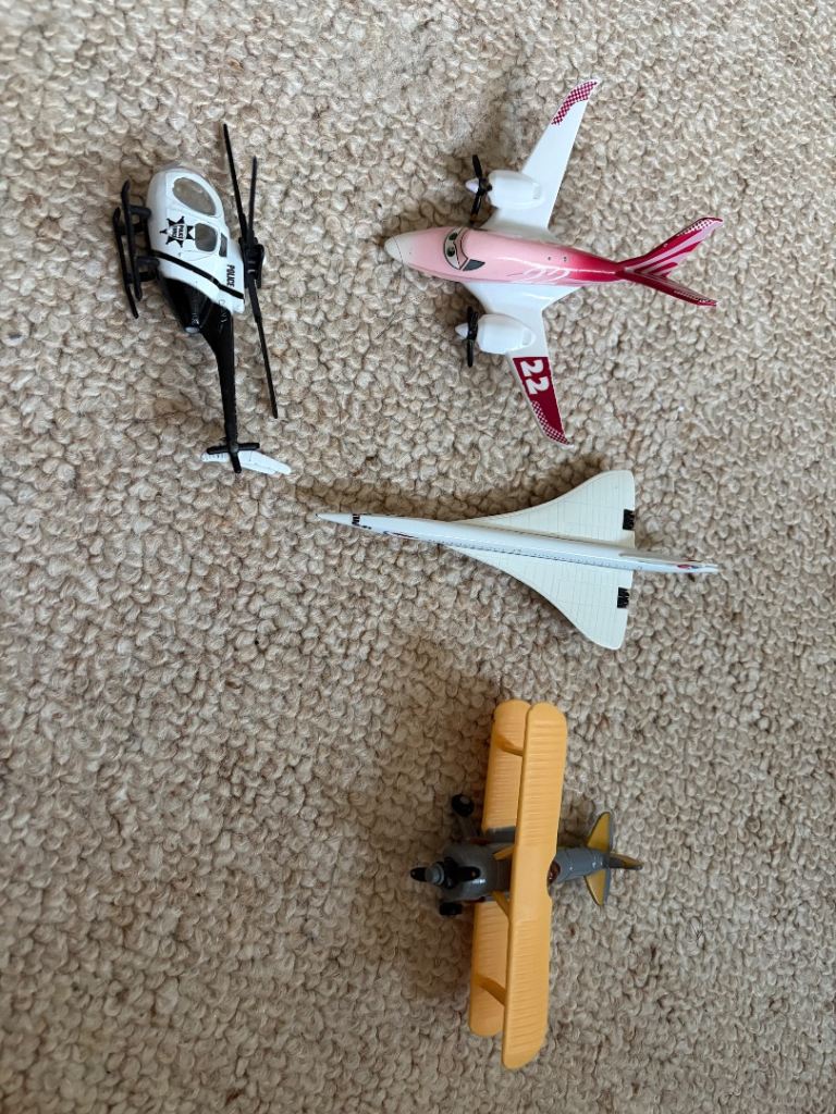 Mixture of used but in good working condition cars and planes