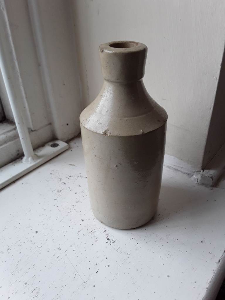 Vintage cream stoneware bottle